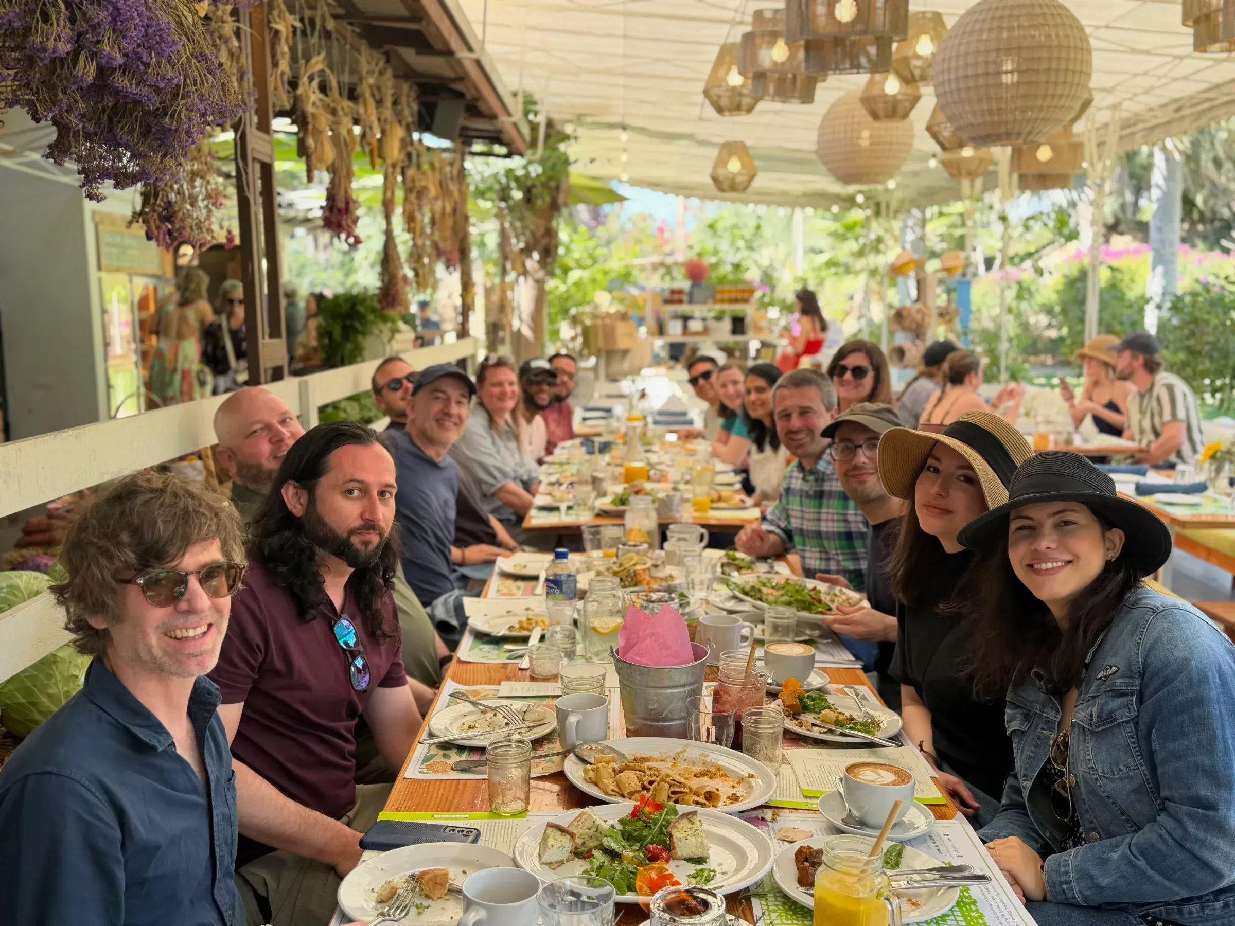 The Enervee team at a long lunch table under a shaded patio in Cabo, 2026